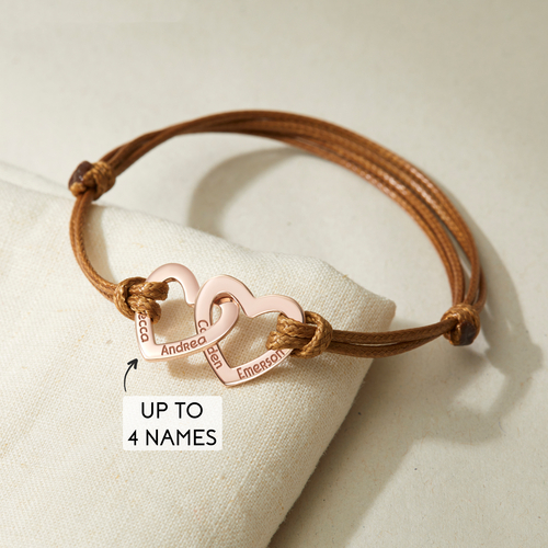 Custom engraved bracelet for grandma with grandchildren's names on double gold hearts and leather cord