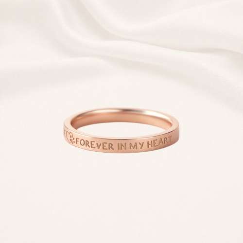 personalized pet name ring with paw print engraving in gold — dog and cat lover keepsake by Keevola Personalized pet name ring with paw print engraving in gold, silver and rose gold by Keevola