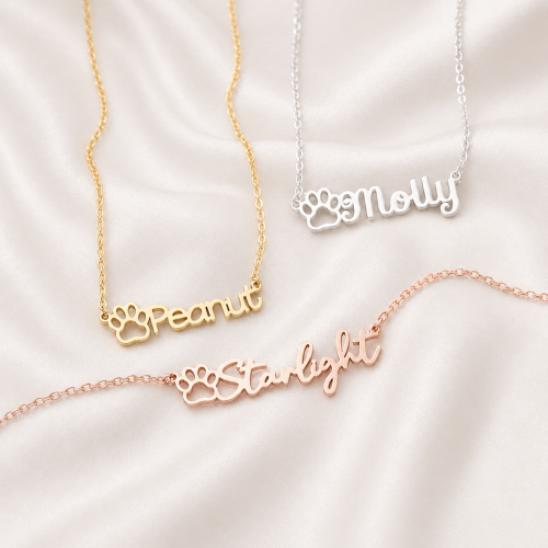 Personalized pet paw name necklaces in gold, silver, and rose