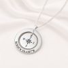 Compass Design Close-Up – GPS Coordinates Engraving Close-up of compass design with engraved GPS coordinates on personalized sterling silver necklace