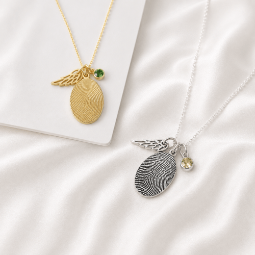 Close-up of a fingerprint engraved across a teardrop pendant
