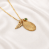 Fingerprint necklace in gold finish with wing charm on the chain