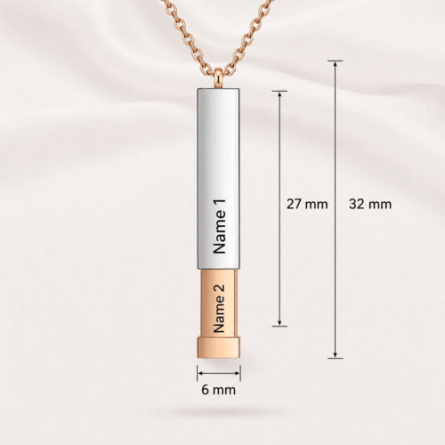 Secret message necklace with inner capsule slid open to reveal the hidden engraving