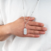 Back of black pendant necklace for men with secret engraved message